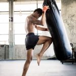 boxers-are-training-their-knees-with-punching-bag-GZDF4SQ.jpg